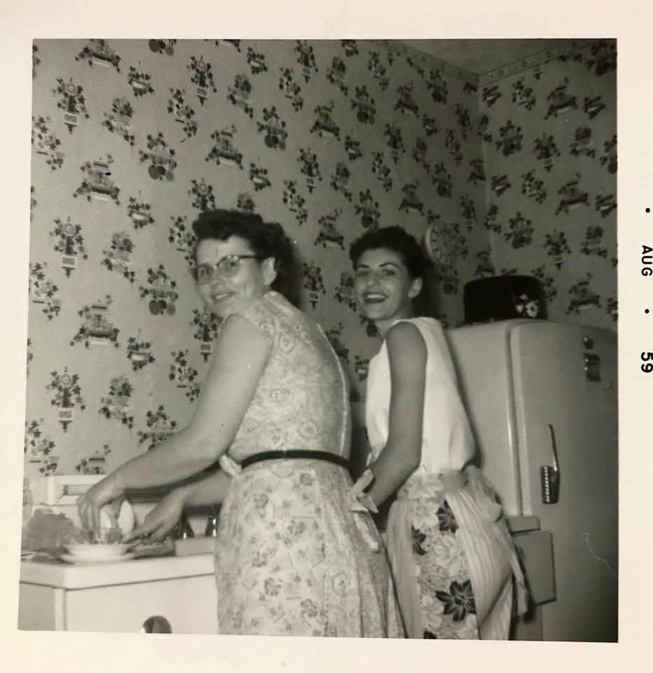 Wearing aprons washing dishes