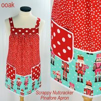 Scrappy Nutcracker Pinafore with no ties, relaxed fit smock with pockets, color-blocked Christmas Apron fits L/XL/2X, ships fast